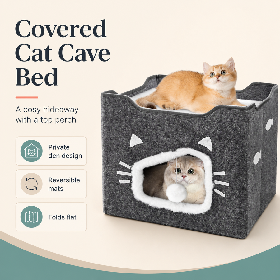 A dark gray felt-covered cat cave bed with a white faux-fur opening and white cat-face details, shown with two cats inside and on top. The left side includes marketing text and feature icons for a private den design, reversible mats, and folding flat.